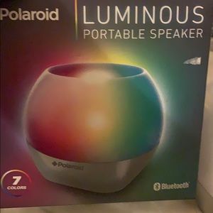 A Polaroid speaker lights up different colors